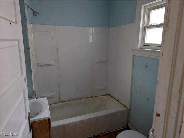 full bathroom featuring bathing tub / shower combination, vanity, and toilet