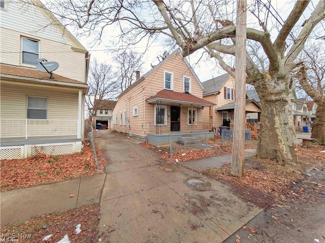 view of front of house with driveway and a porch