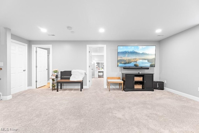 carpeted living room with baseboards and recessed lighting