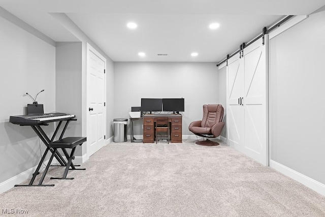 carpeted office space with a barn door, baseboards, and recessed lighting