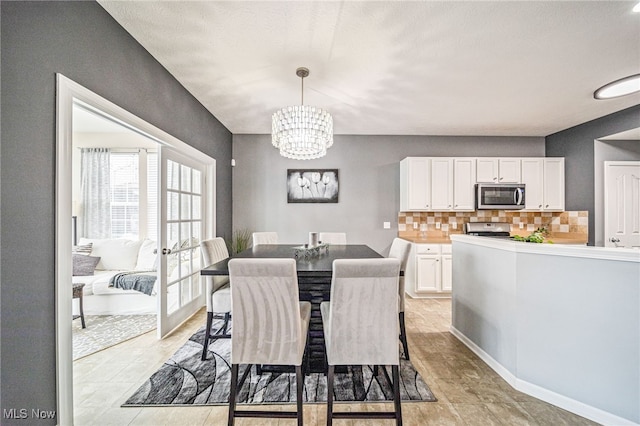 dining room with an inviting chandelier