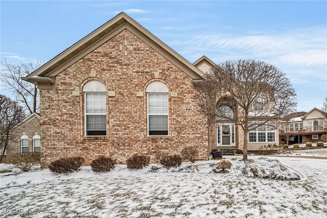 view of front of home featuring brick siding