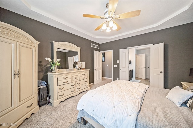 bedroom with light carpet, ceiling fan, and visible vents