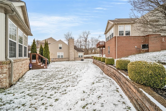 view of yard covered in snow