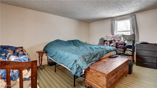 carpeted bedroom with a textured ceiling