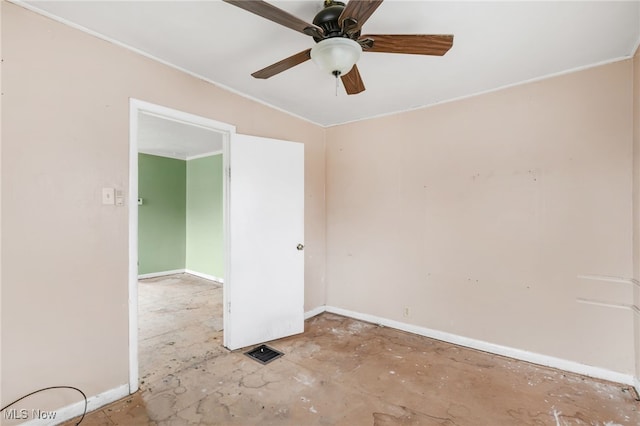 spare room with ceiling fan, unfinished concrete floors, visible vents, and baseboards