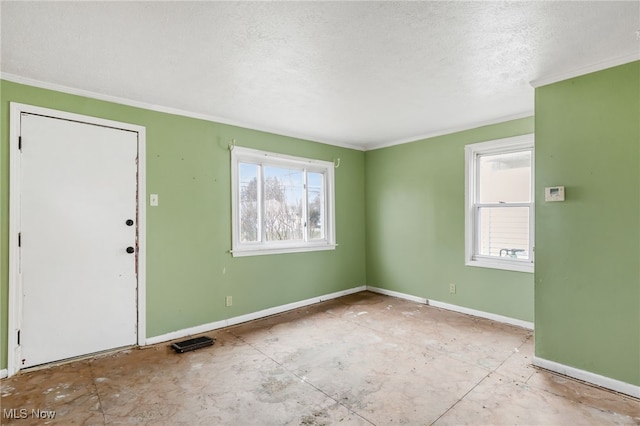 interior space with crown molding, a textured ceiling, and baseboards