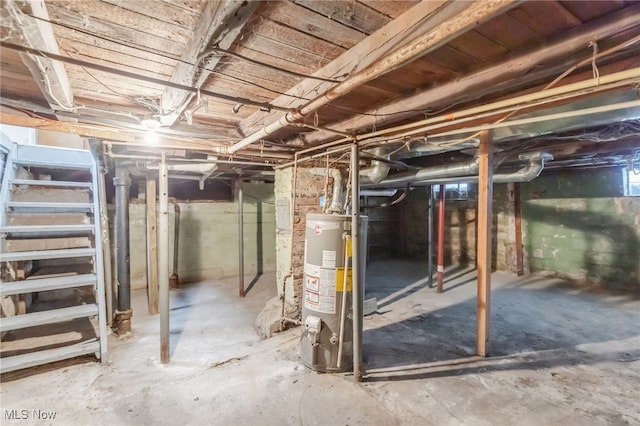 unfinished basement featuring water heater