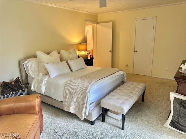 bedroom with carpet and crown molding