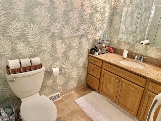 bathroom with wallpapered walls, visible vents, toilet, tile patterned flooring, and vanity