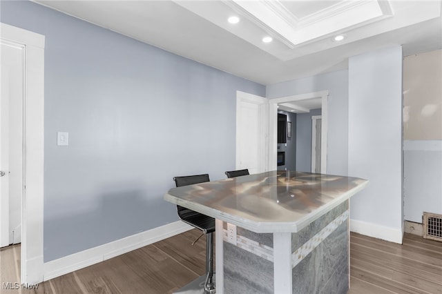 interior space with recessed lighting, crown molding, baseboards, and wood finished floors