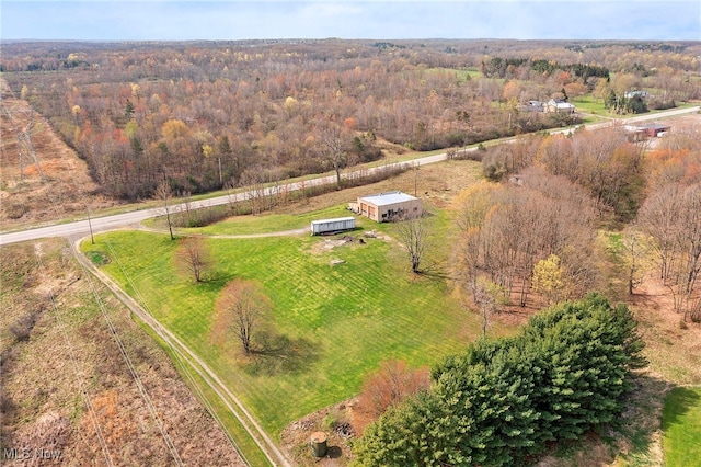 birds eye view of property featuring a rural view and a view of trees