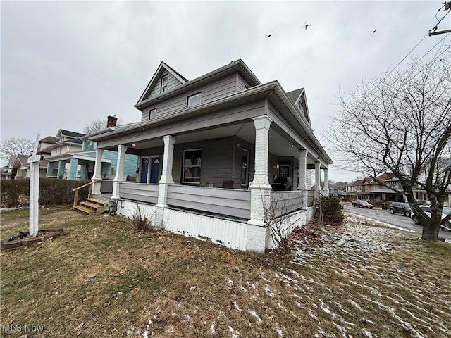 view of home's exterior with covered porch