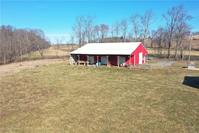 exterior space with driveway and a lawn