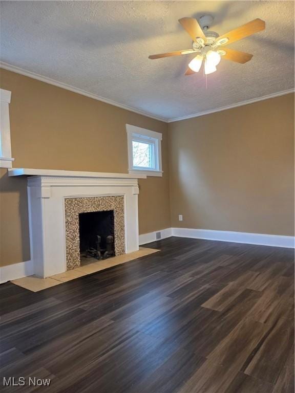 unfurnished living room with a fireplace with flush hearth, ornamental molding, a textured ceiling, and wood finished floors