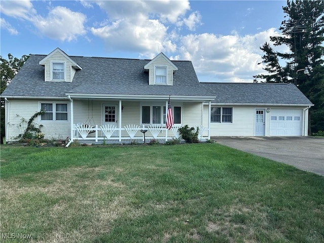 cape cod home with covered porch, roof with shingles, an attached garage, and a front lawn