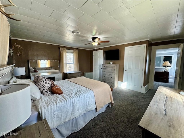 bedroom featuring carpet, ornamental molding, and a ceiling fan