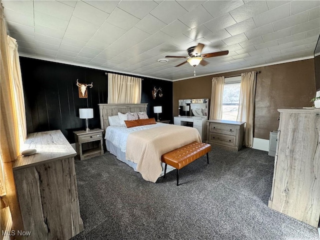 bedroom with ceiling fan, ornamental molding, and carpet flooring