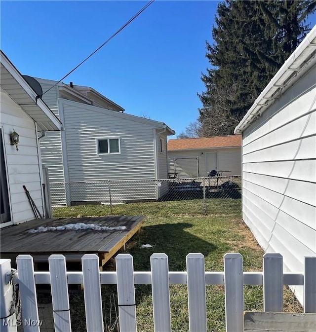 view of yard featuring a fenced front yard and a wooden deck