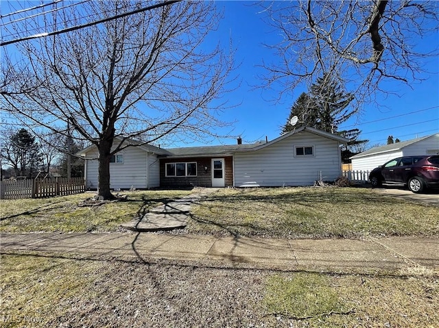 single story home featuring fence