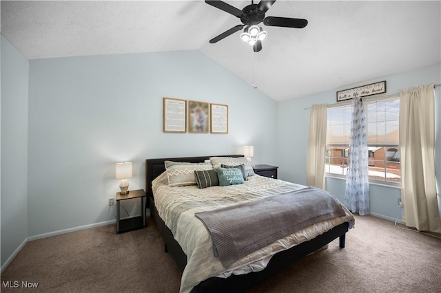 carpeted bedroom featuring baseboards, lofted ceiling, and a ceiling fan