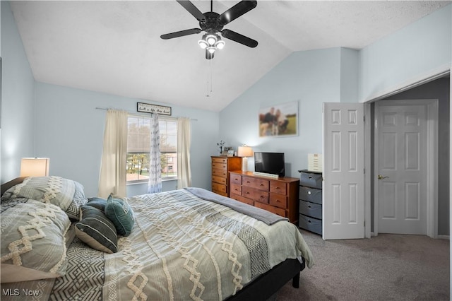 bedroom with ceiling fan, carpet, and vaulted ceiling