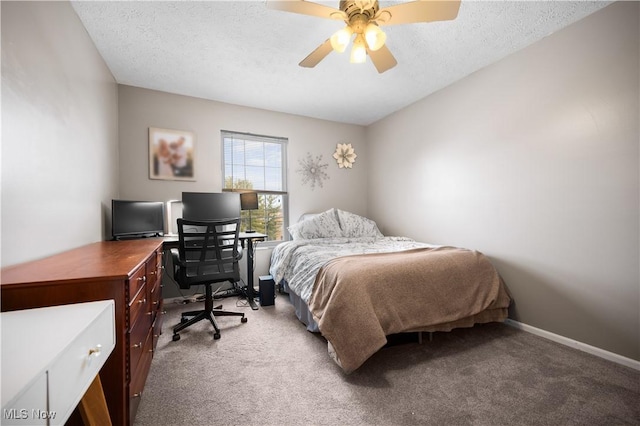 bedroom with light colored carpet, a textured ceiling, baseboards, and a ceiling fan