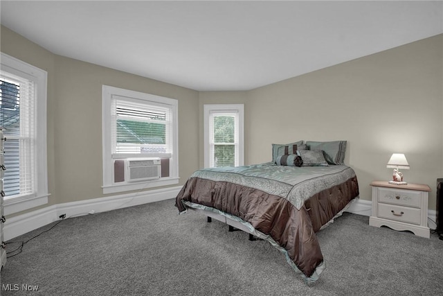 carpeted bedroom with cooling unit and baseboards