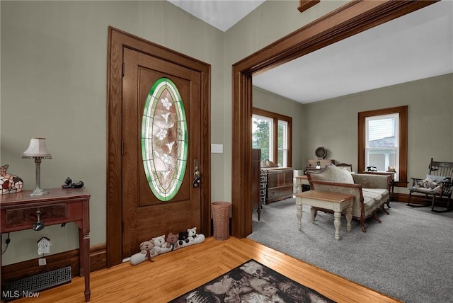 entryway with a healthy amount of sunlight and wood finished floors