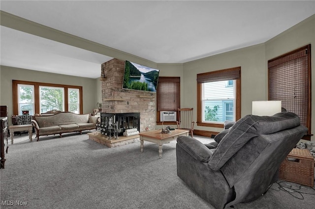 carpeted living area with a fireplace