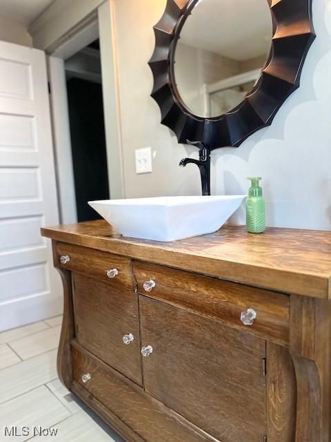 bathroom with vanity and tile patterned floors