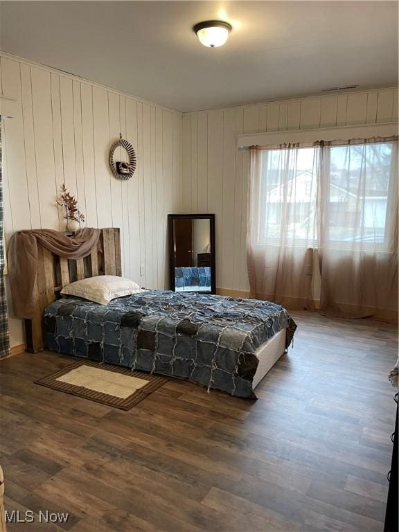 bedroom featuring wood finished floors