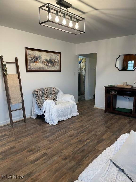 interior space featuring baseboards and wood finished floors