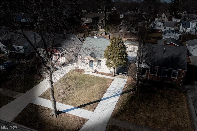 birds eye view of property with a residential view