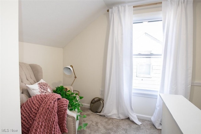 sitting room with lofted ceiling, carpet flooring, and baseboards