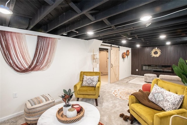 interior space with a barn door and carpet