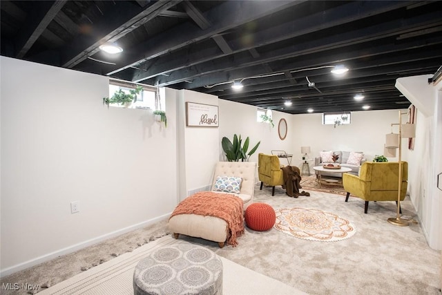 basement with carpet flooring and baseboards