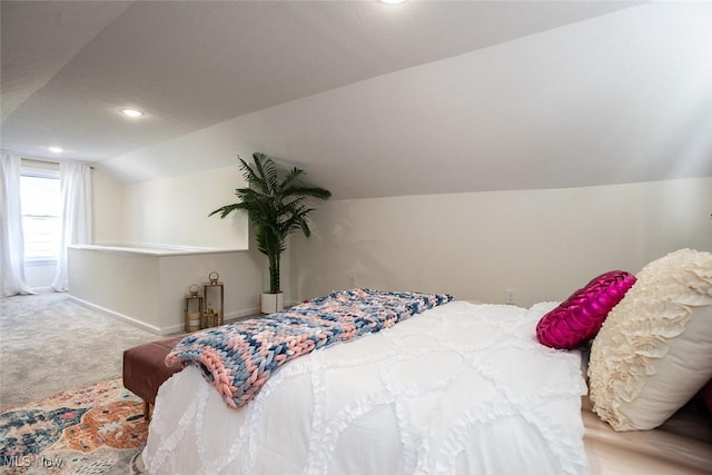 carpeted bedroom featuring lofted ceiling, baseboards, and recessed lighting