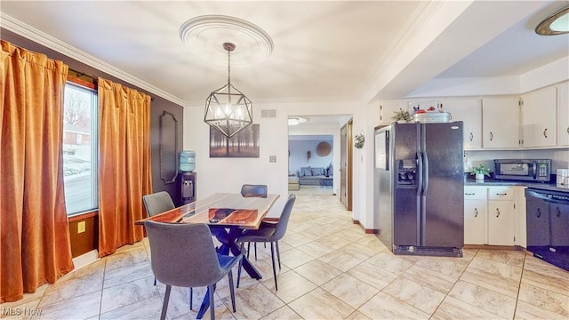 dining area featuring visible vents, crown molding, and baseboards