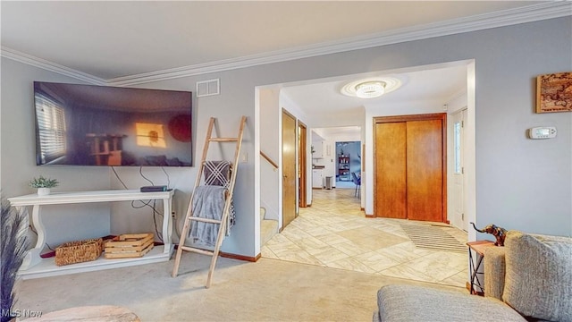 corridor featuring visible vents, crown molding, carpet flooring, and stairs