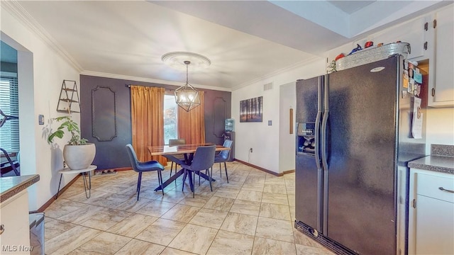 dining space with visible vents, crown molding, baseboards, and an inviting chandelier