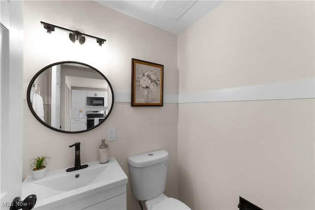 bathroom featuring vanity and toilet