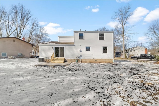 back of property featuring entry steps and cooling unit