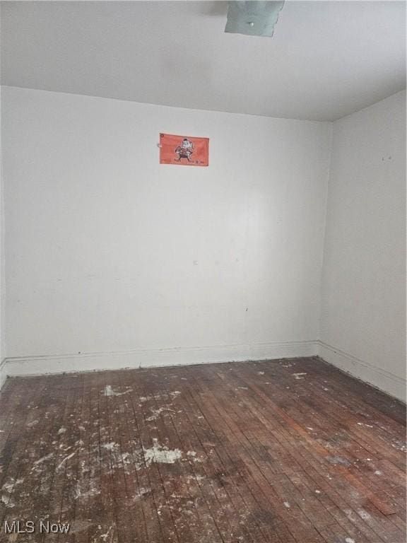 spare room with hardwood / wood-style floors