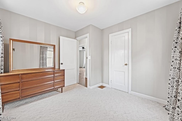 carpeted bedroom with baseboards