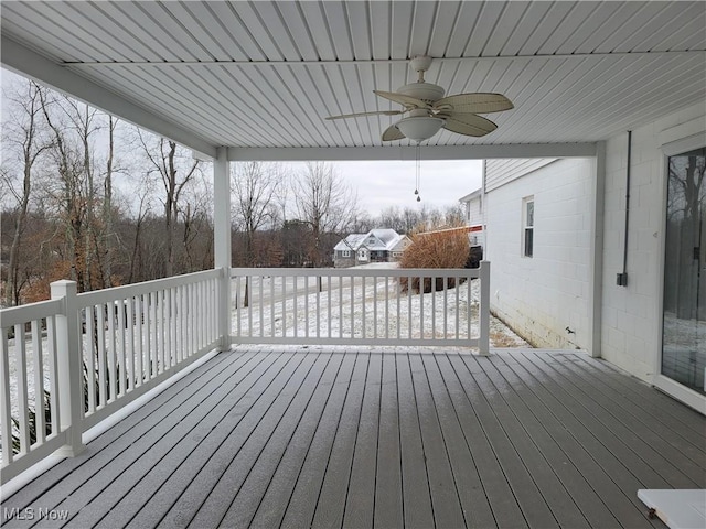 wooden terrace featuring a ceiling fan