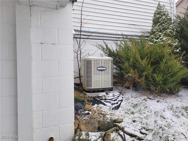 details with central AC unit and concrete block siding