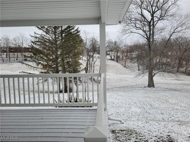 view of snow covered deck