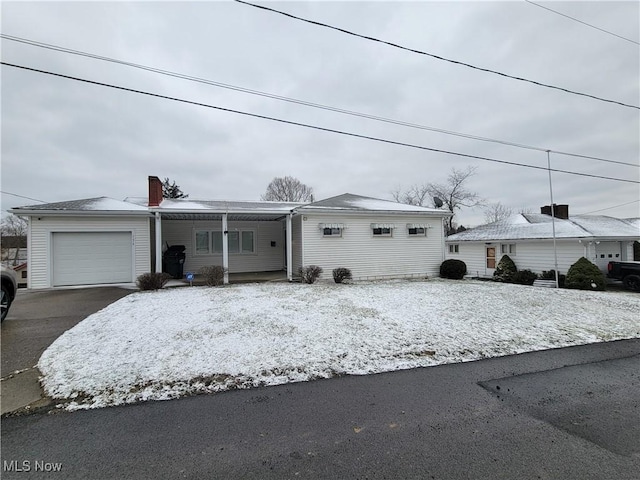 view of front facade featuring driveway and an attached garage