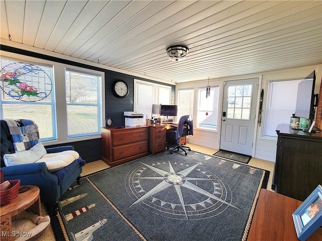 carpeted office featuring wooden ceiling